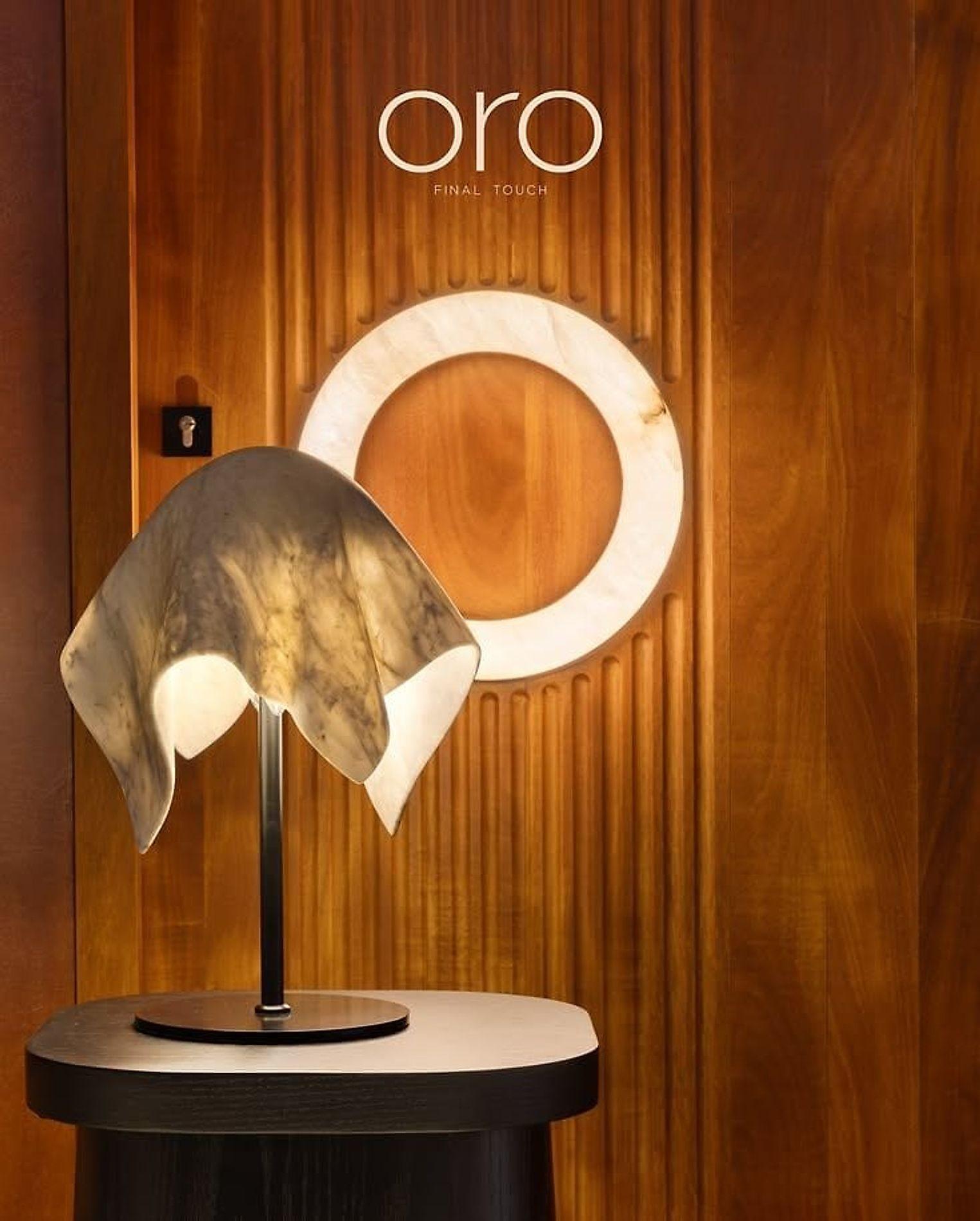 Alabaster Veil — a sheet of hand-carved alabaster lit from within on a steel foot
