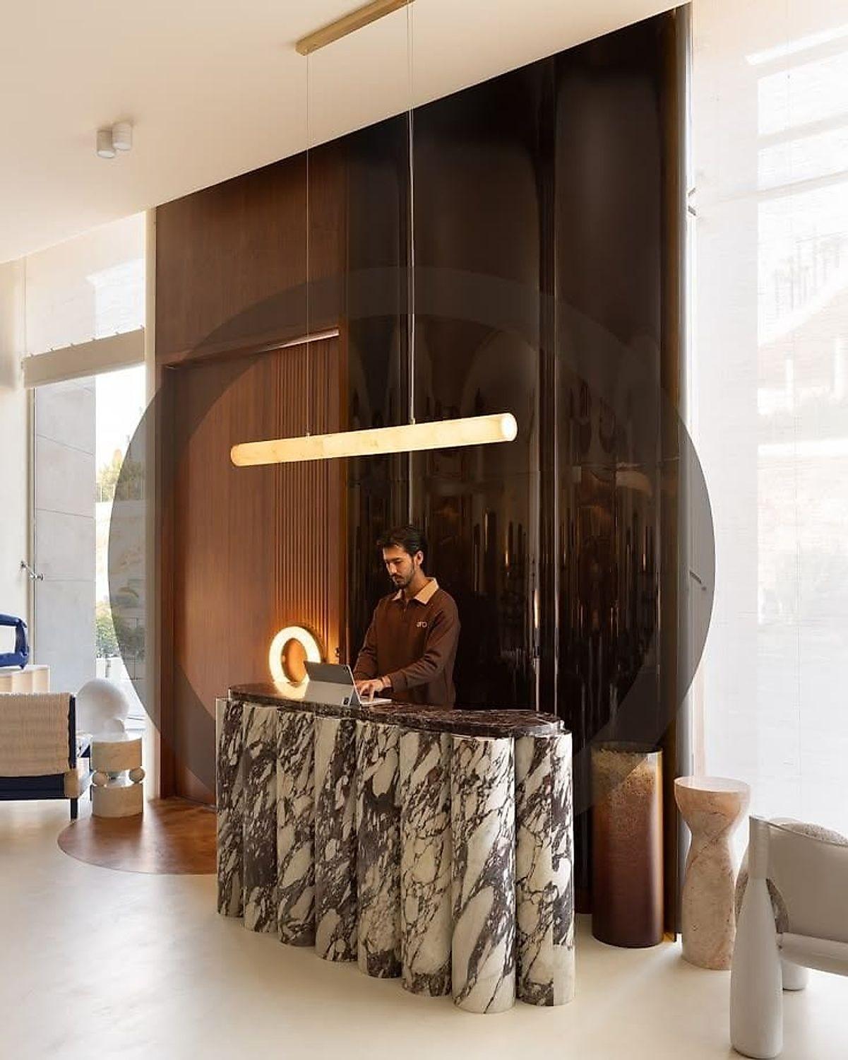 The showroom bench — a marble top in a warm timber-lined room