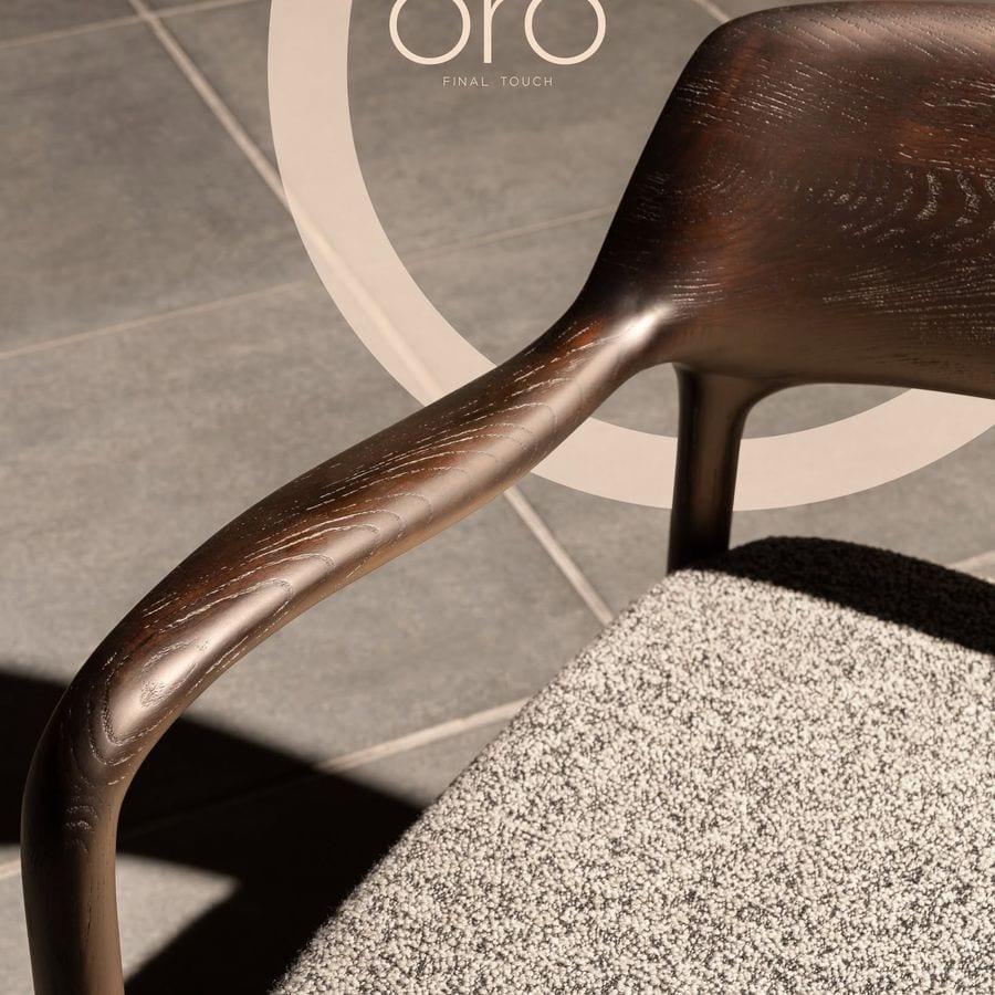 Close crop of oiled walnut grain and a bouclé edge